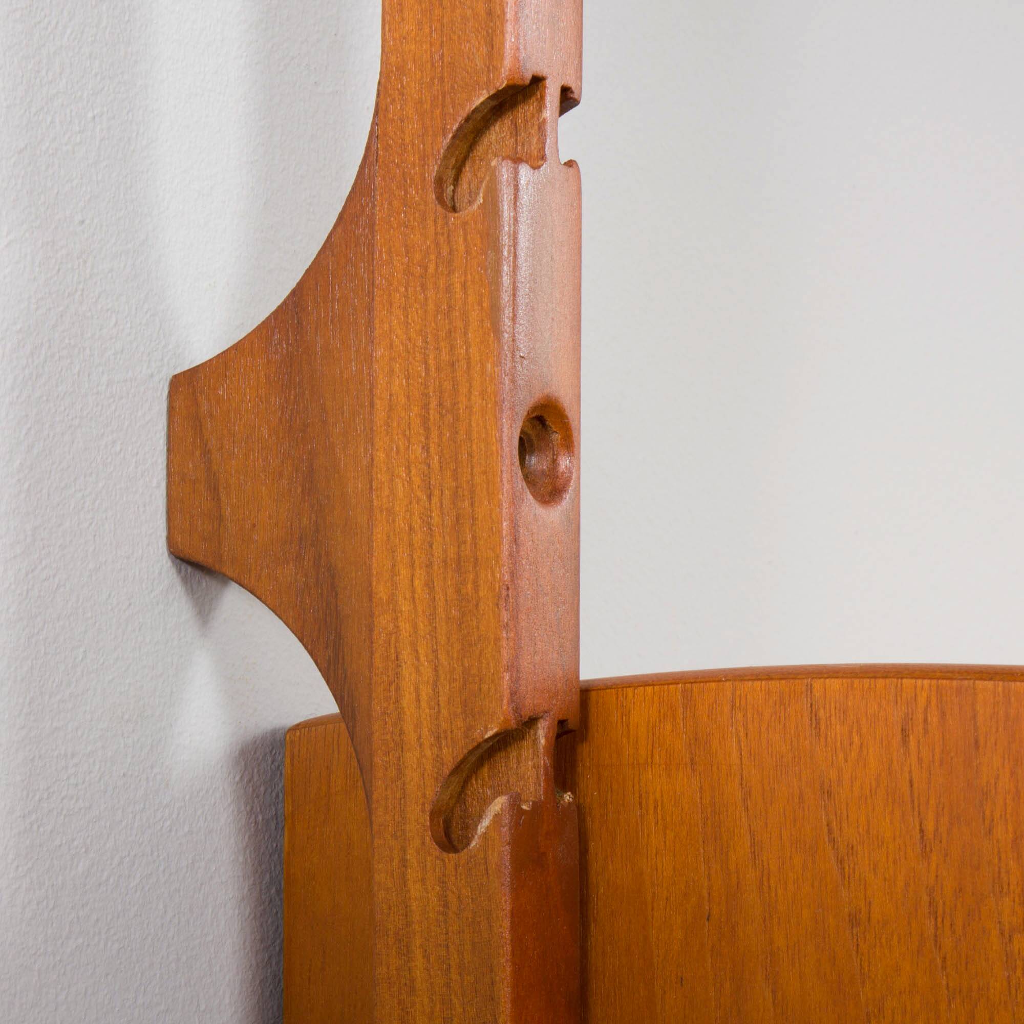 Scandinavian modern wall shelving system Ergo in teak by J. Texmon, Norway, 1960s