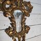 Italian mirror in gilded wood with gold leaf from the 18th century.