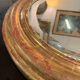Golden oval mirror