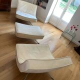 Two armchairs and a pop footstool from Roset