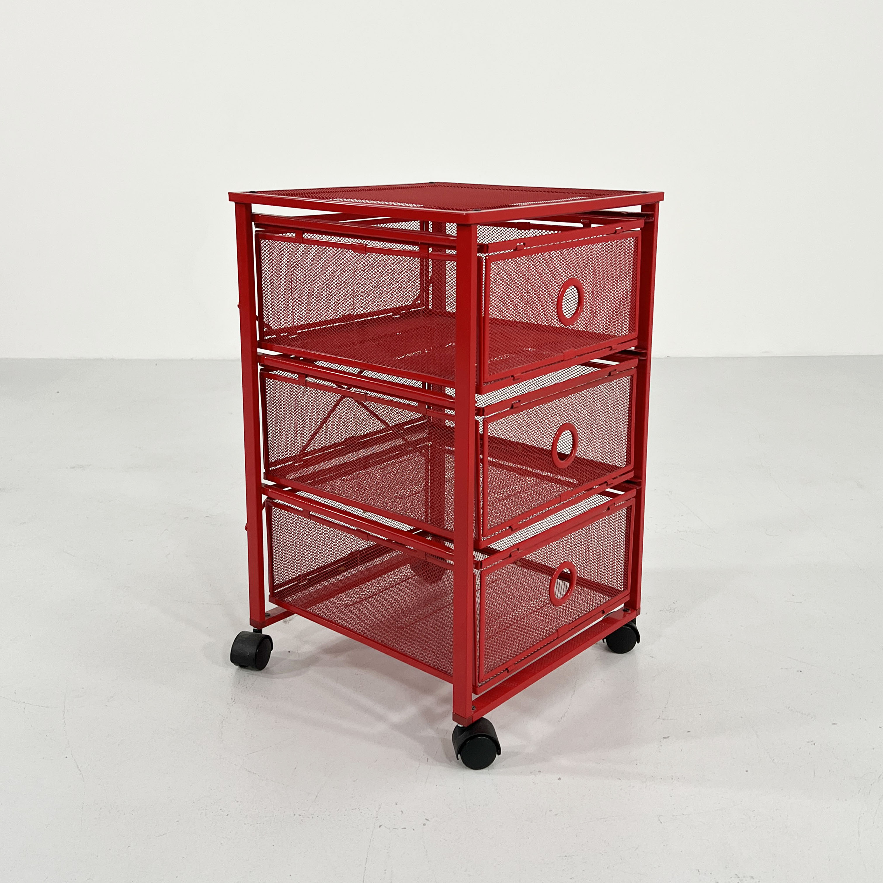 Chest of drawers on red metal wheels, 1980