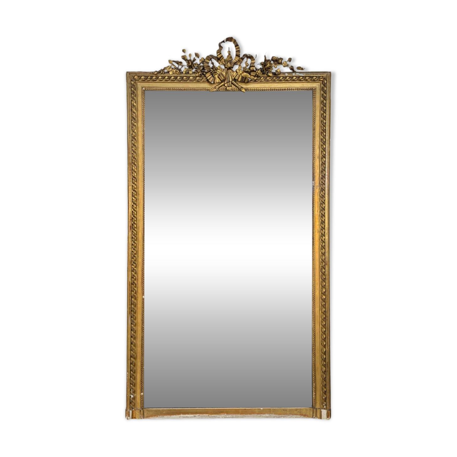 Golden Louis XVI style mirror with bouquet and shells.