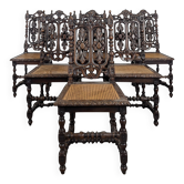 Série de 6 chaises Henri II en chêne sculpté ajouré assise cannée