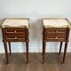 Pair of mahogany and brass side tables or bedside tables with Carrara marble tops.