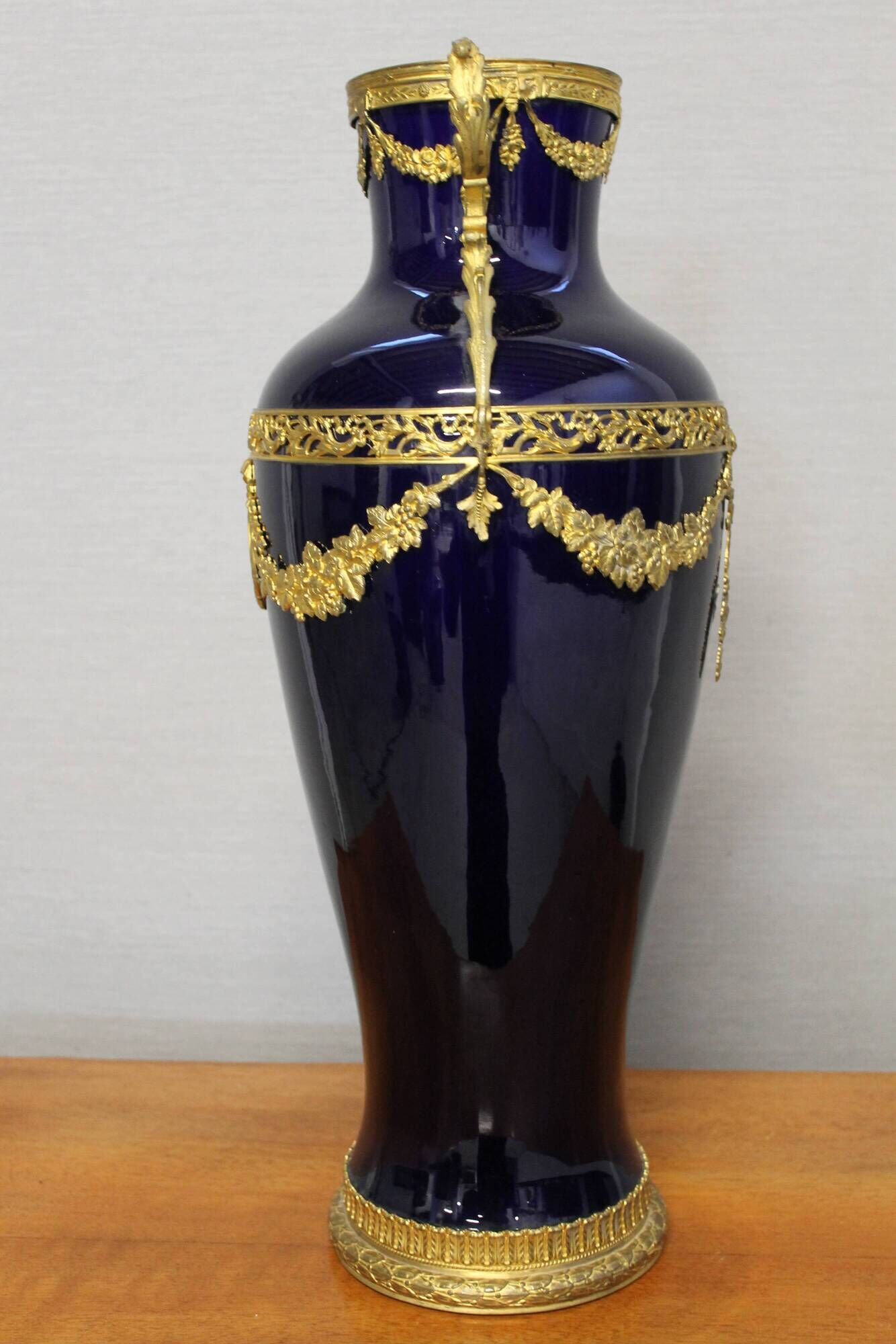 Vase signed Legastelois in blue ceramic of Sèvres and gilded bronze