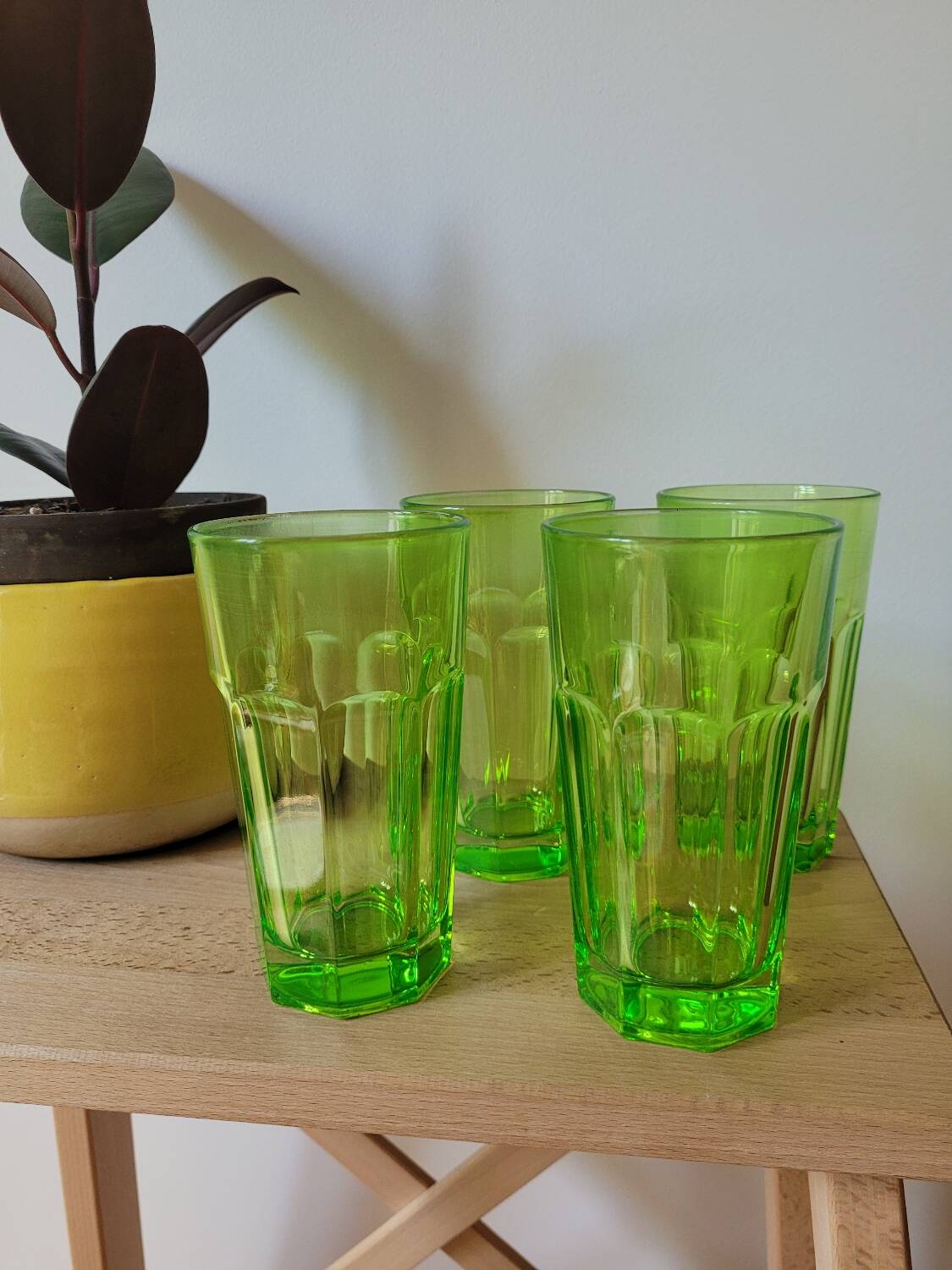 Four neon green lemonade glasses