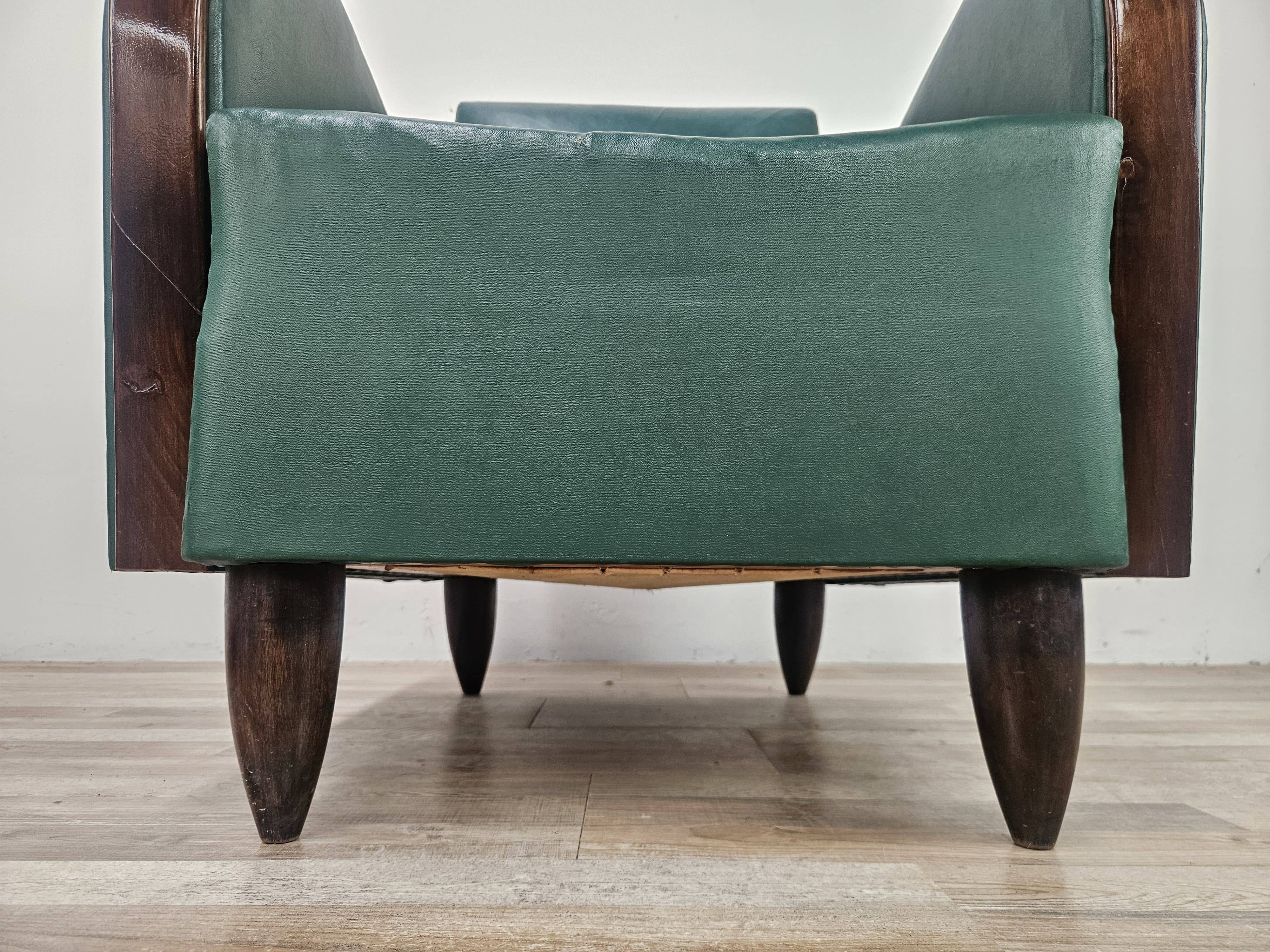 Pair of Art Decò armchairs in walnut and green leather, 1940