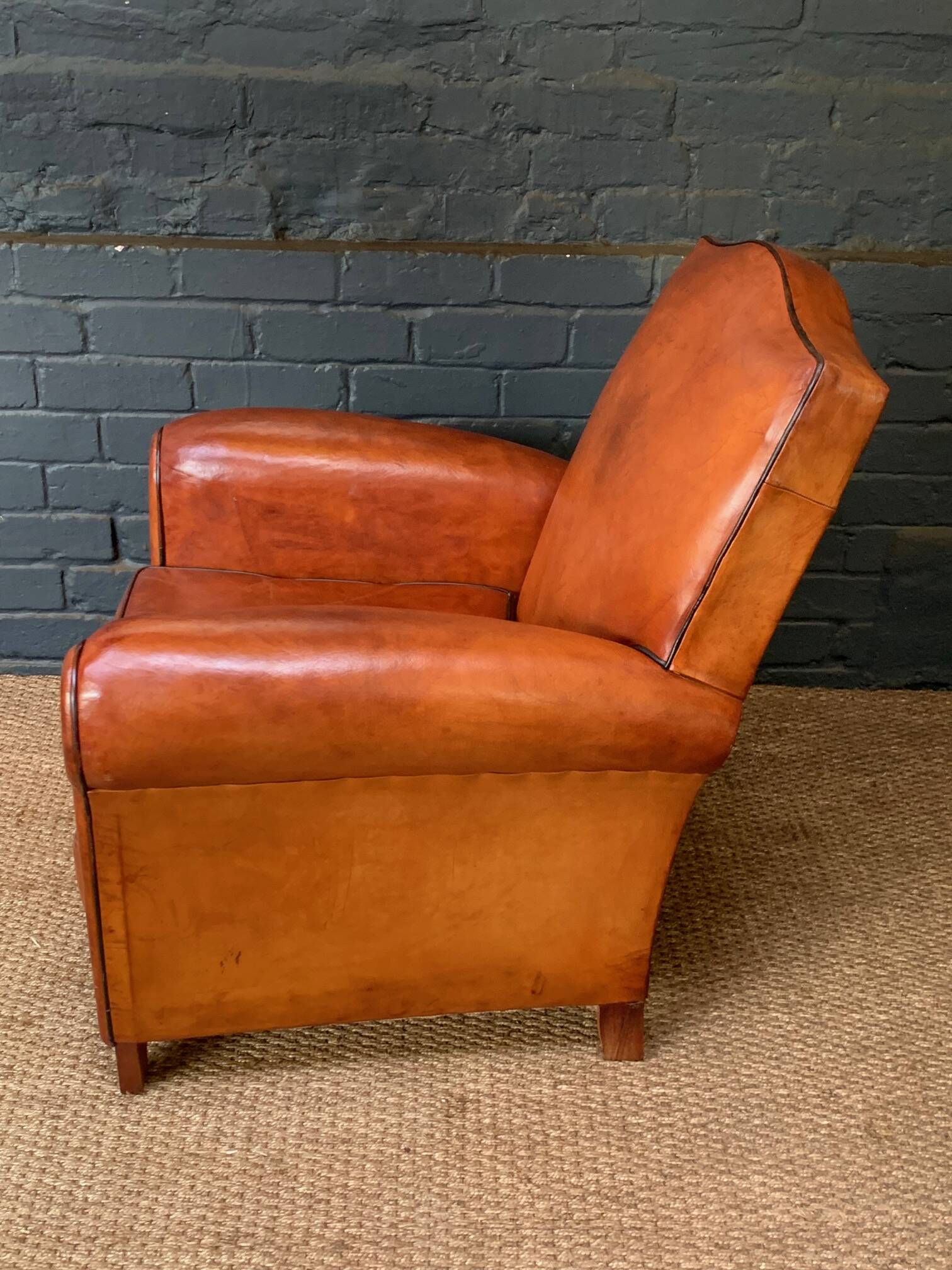 French leather club chair, chapeau de gendarme model circa 1930's in caramel