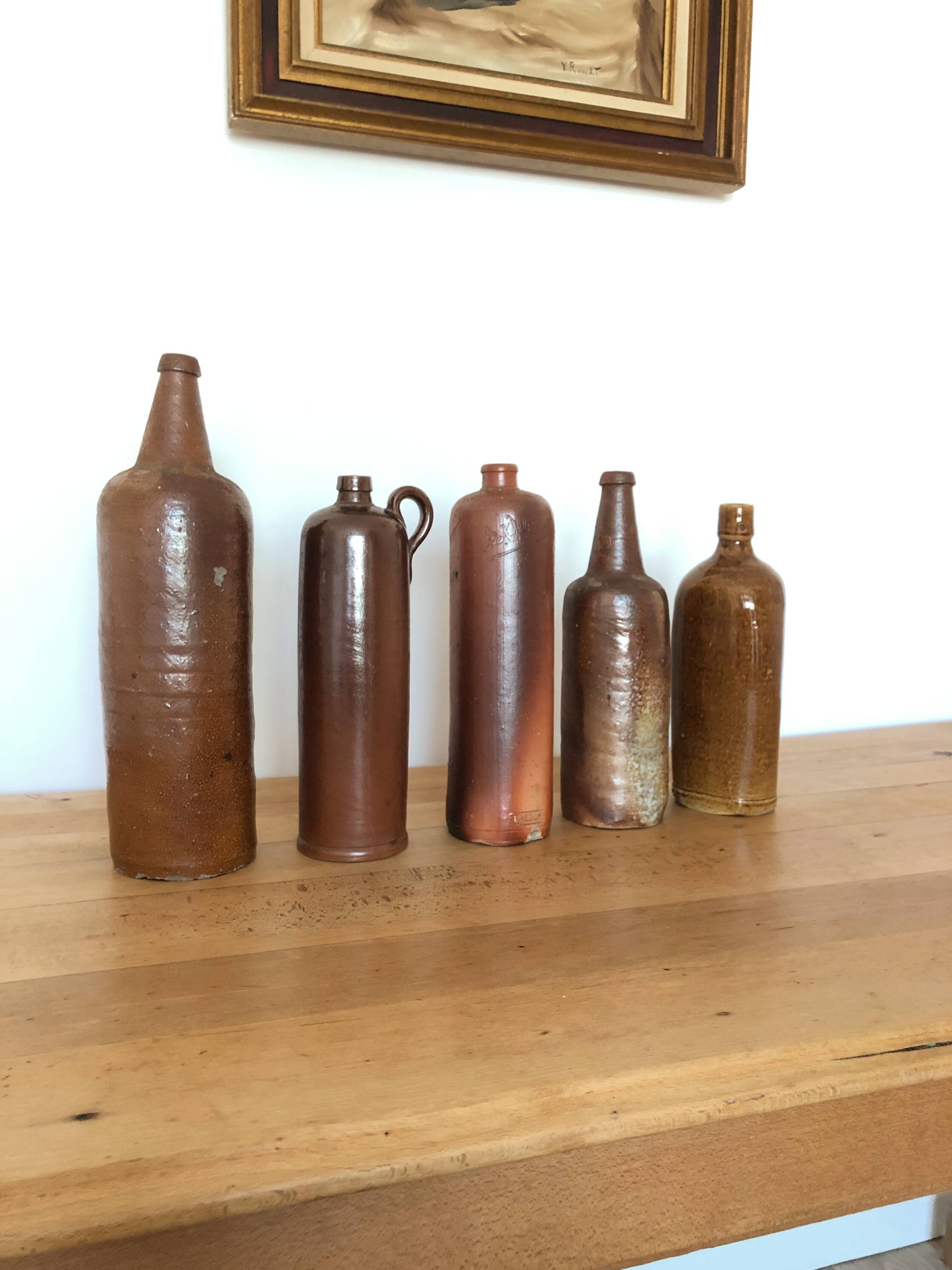 Set of 5 antique glazed stoneware bottles