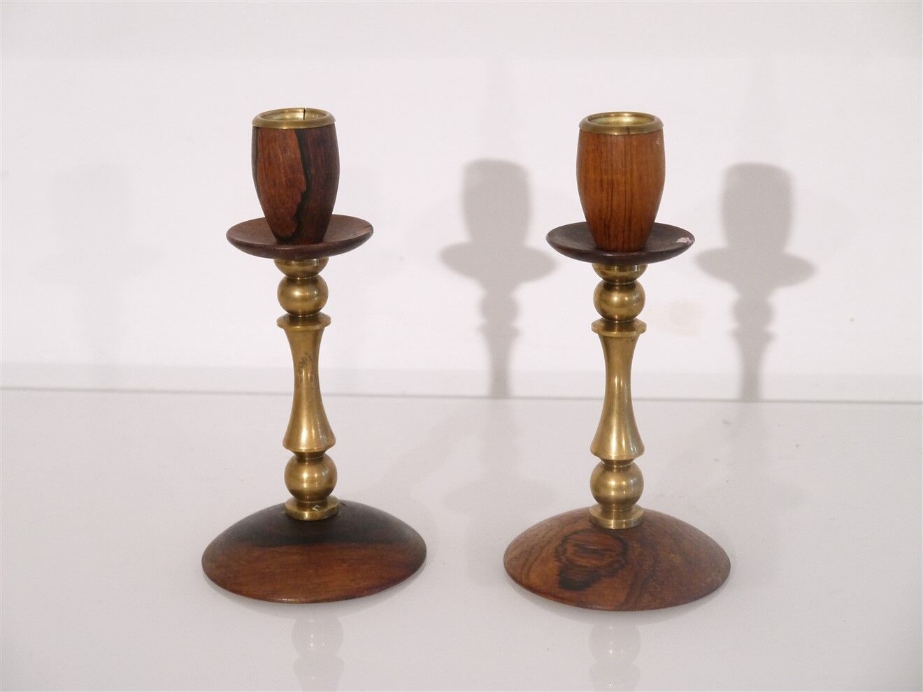 Pair of Scandinavian teak and brass candle holders