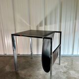 Vintage design magazine rack in chrome metal