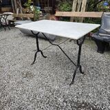 Bistro table with marble top and cast iron base