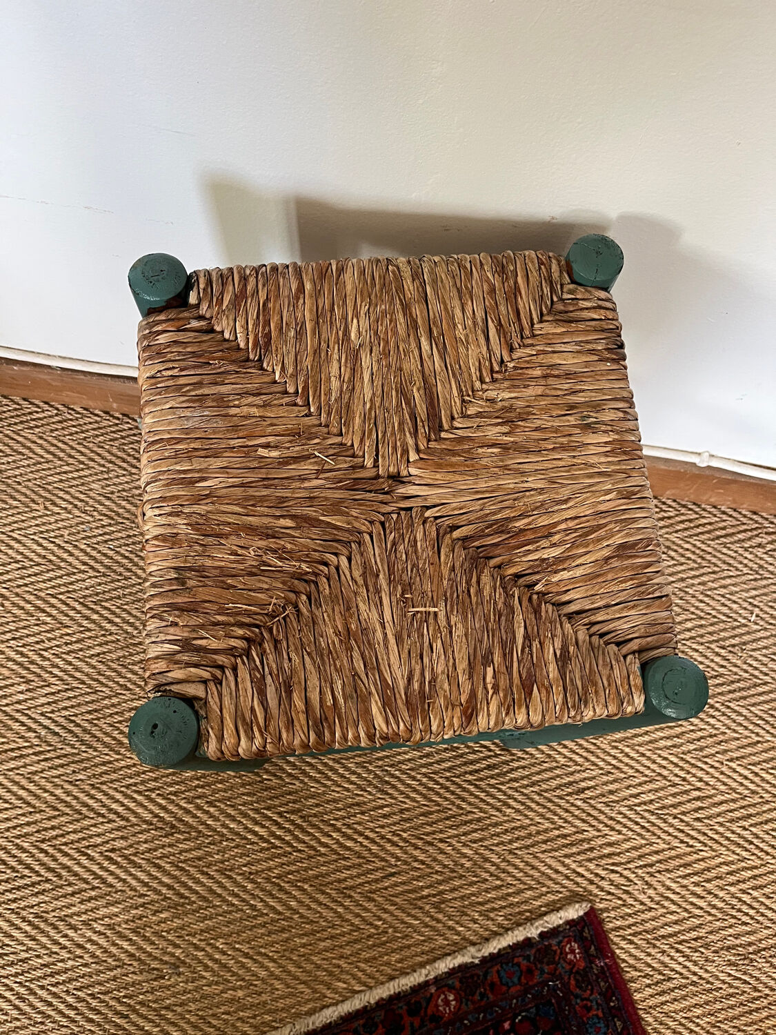 Vintage stool in green patinated wood and straw