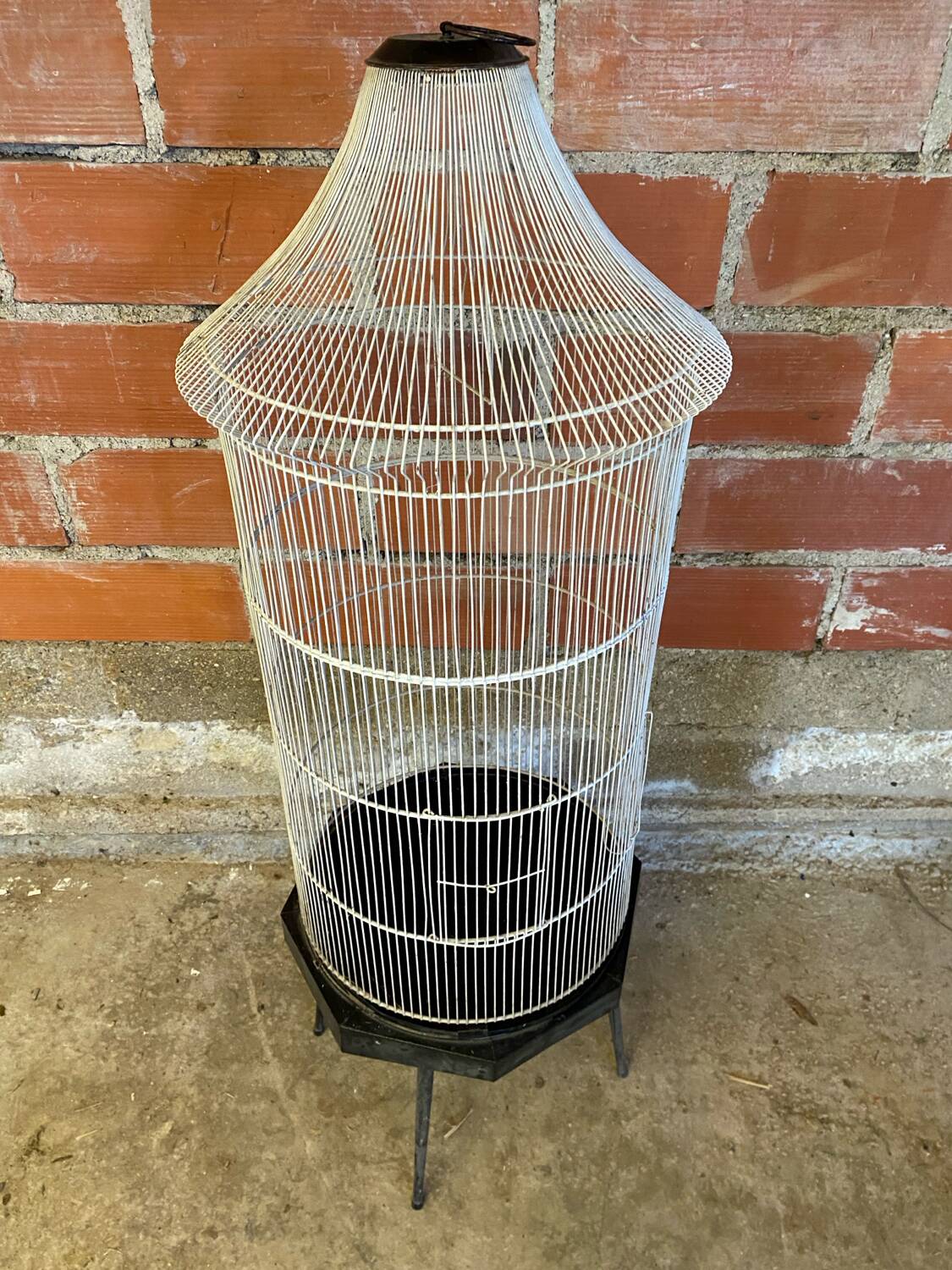 Antique black & white metal bird cage on vintage decorative legs