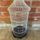 Antique black & white metal bird cage on vintage decorative legs