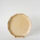 Ceramic trivet, butter yellow and gold, 1960.