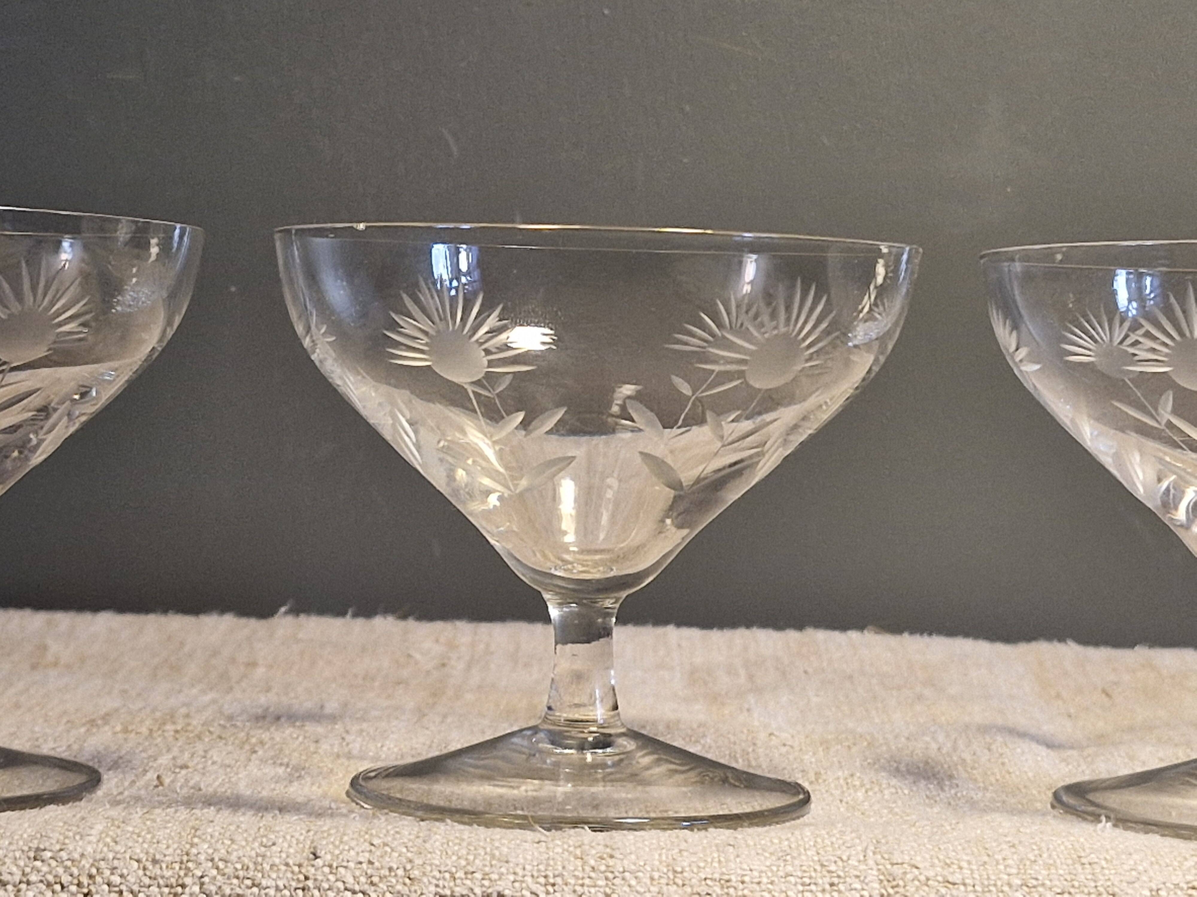 3 antique champagne coupes in engraved crystal with large daisies.