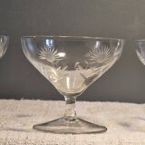 3 antique champagne coupes in engraved crystal with large daisies.