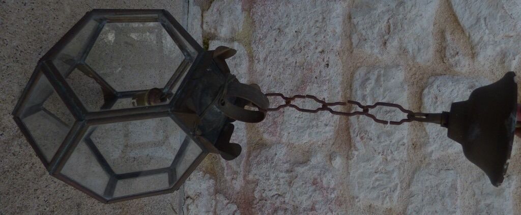 Old lantern in brass and glass with 8 facets or 24 stained glass windows