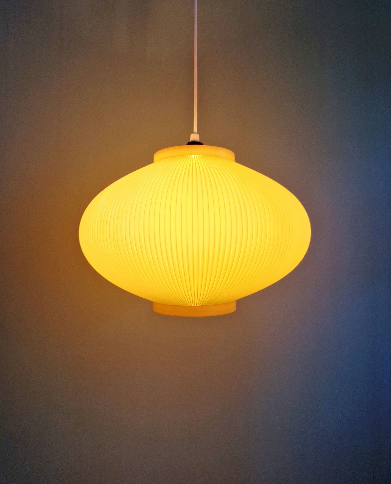 Vintage oval-shaped suspension in pleated celluloid, light green colour, 1960.