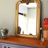 Gilded mirror with a Louis Philippe style pediment
