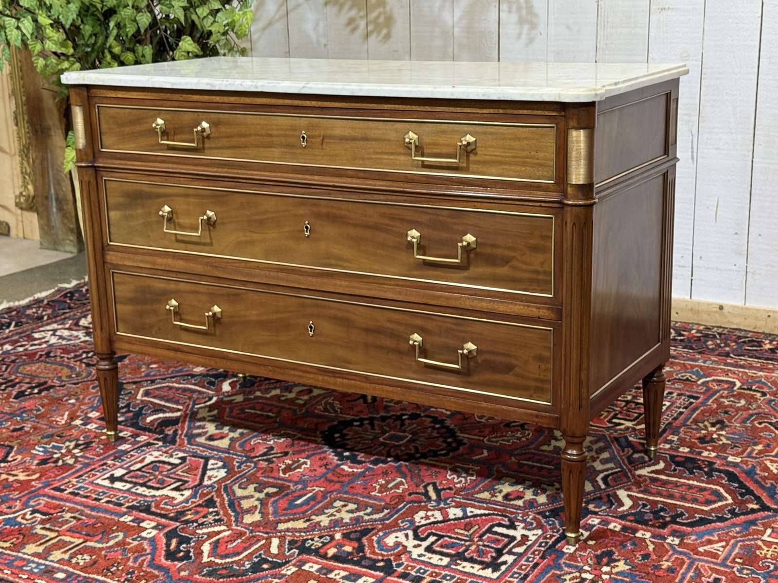 Louis XVI commode in mahogany with a marble top from the 1950s.