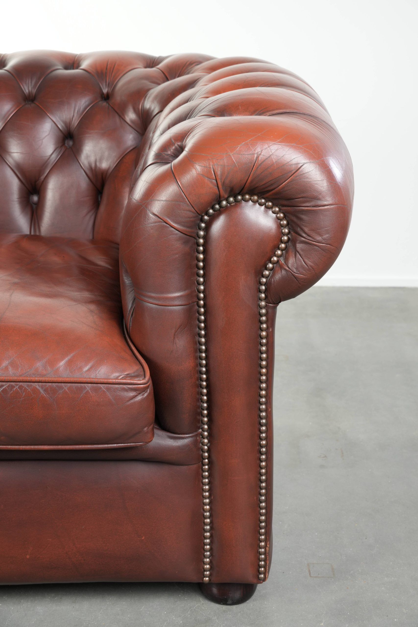 Cowhide Chesterfield armchair in a classic English style