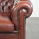 Cowhide Chesterfield armchair in a classic English style