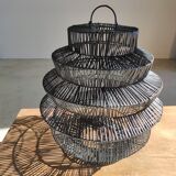 Braided rattan suspension in the shape of a black accordion