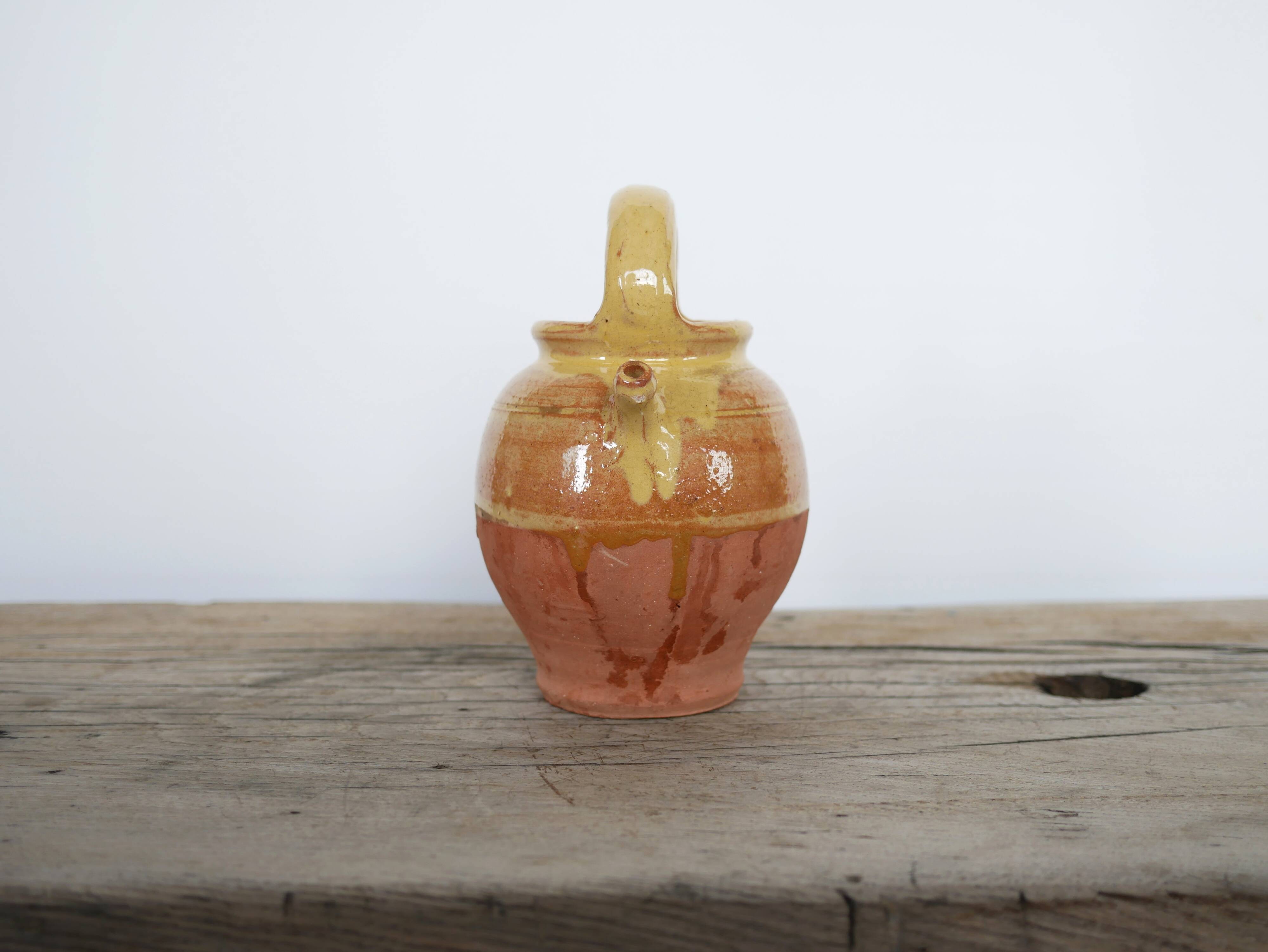 Old gargoulette pot in glazed terracotta