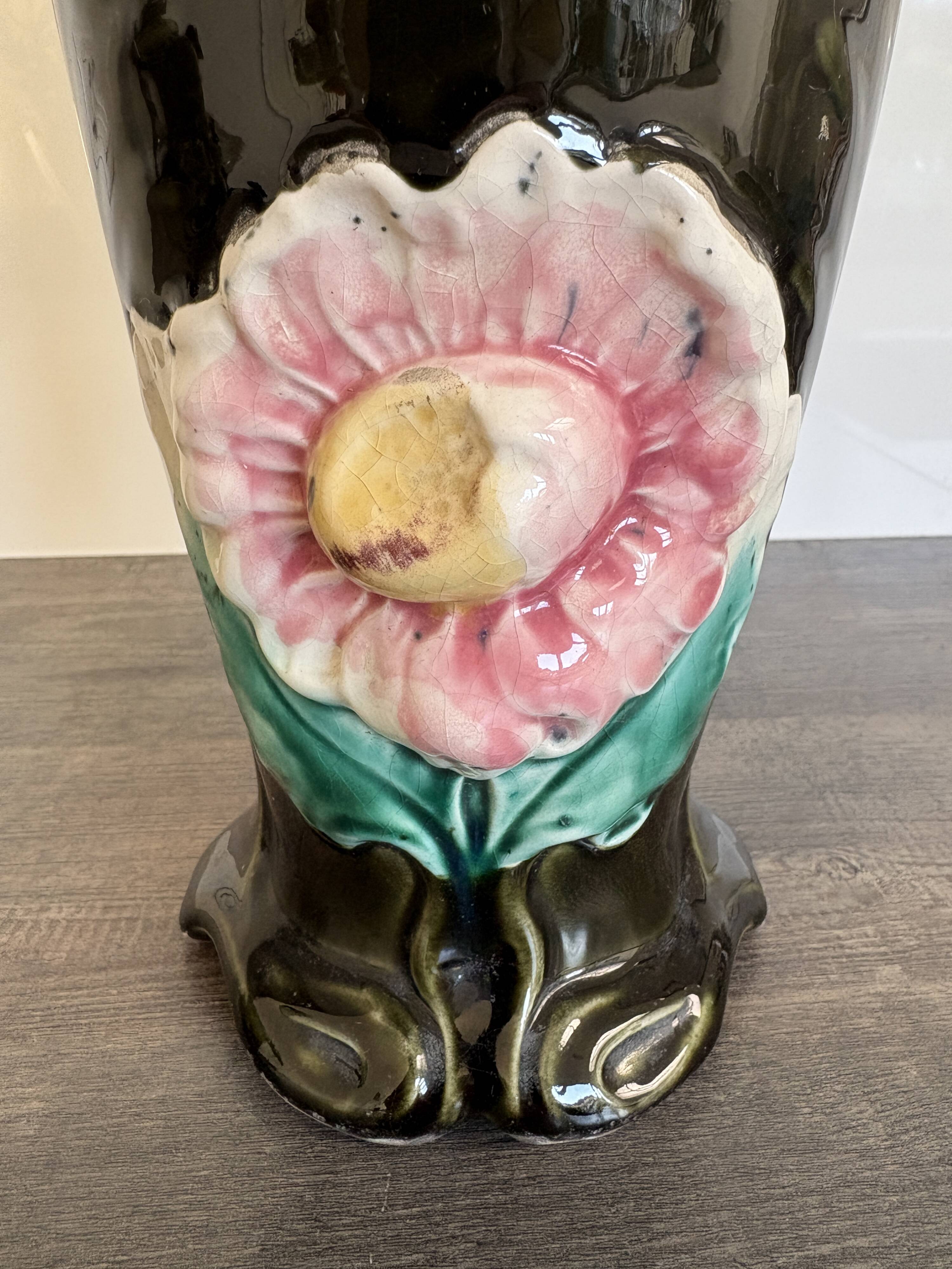 Antique ceramic vase by De Bruyn with floral decoration.