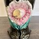 Antique ceramic vase by De Bruyn with floral decoration.