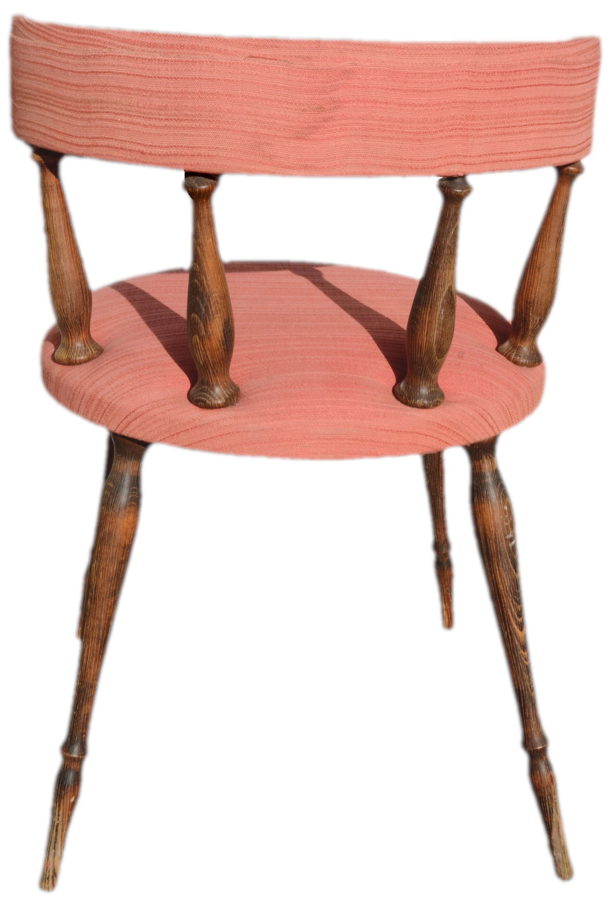 Pink gondola armchair in the style of Helmut.