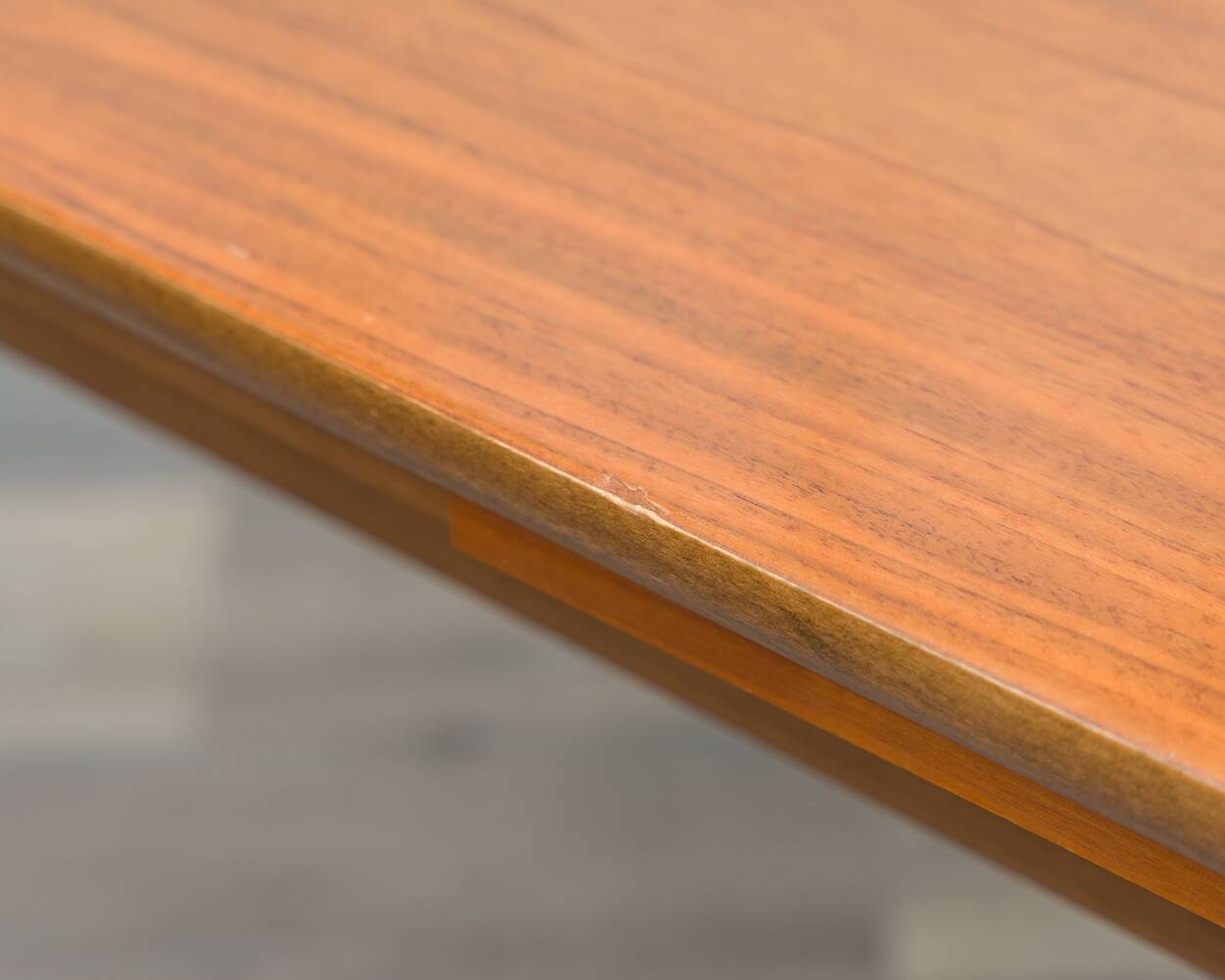 Dining table, 1960s, in walnut, slightly elliptical shape.