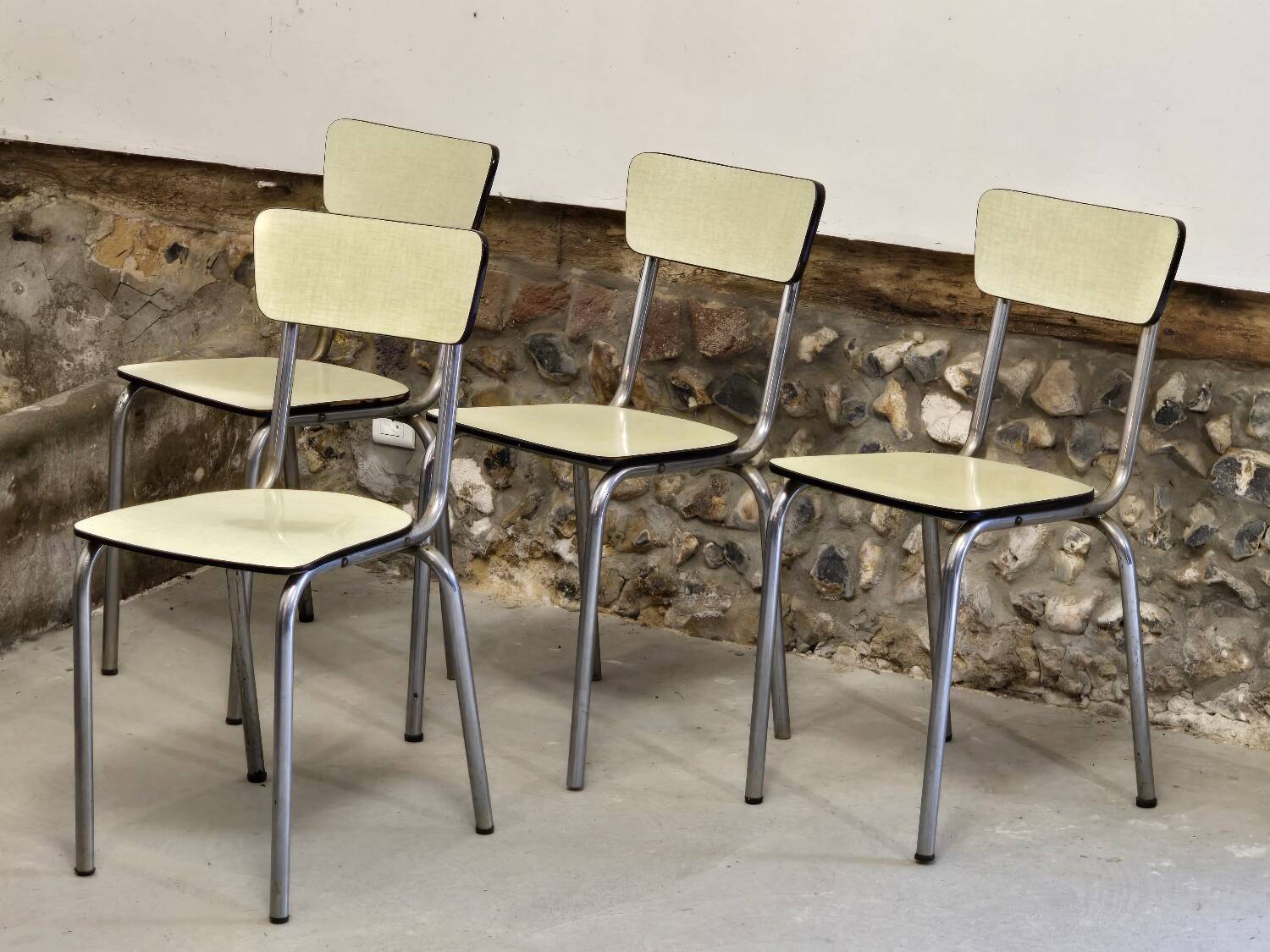 Set of 4 light yellow formica chairs
