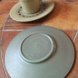 A pair of vintage glazed stoneware cups and saucers.