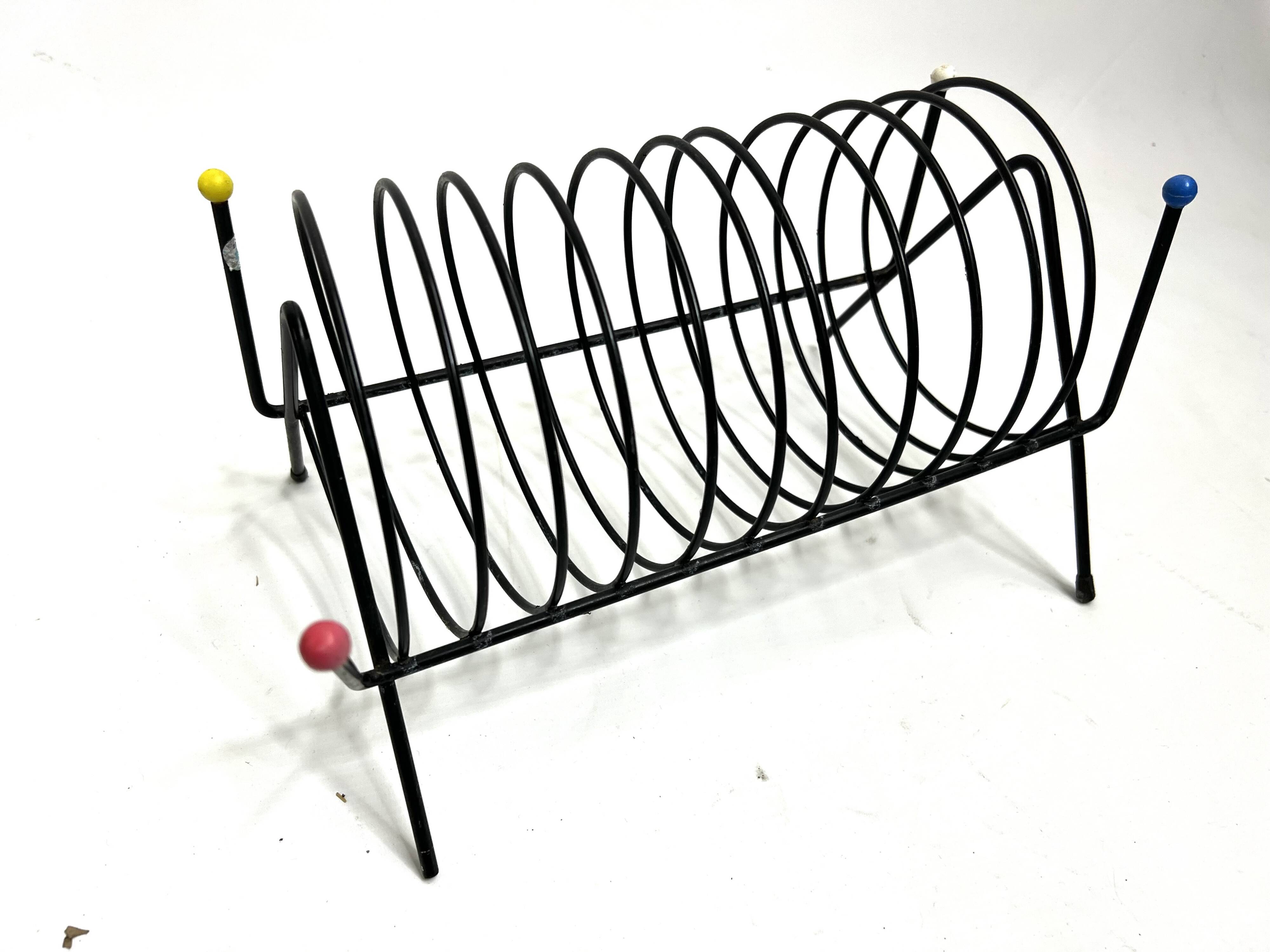 Porte-revues vintage en métal laqué noir – Design 1950s multicolore