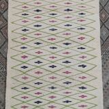 Handmade geometric patterned rug in natural wool