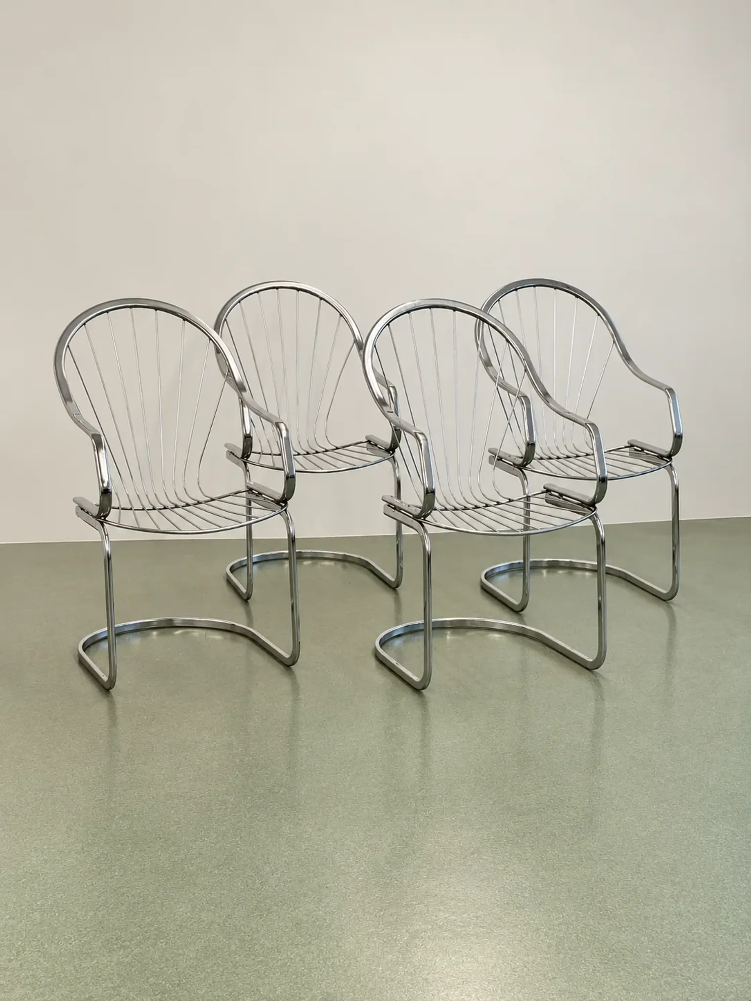 Set of four chrome cantilever dining chairs, 1970s