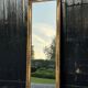 Miroir Empire en bois stuqué et doré, début XIXème siècle