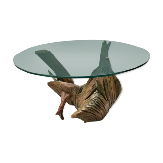 Table en verre et souche d’arbre