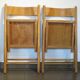 Pair of vintage wooden folding chairs with star pattern on seat