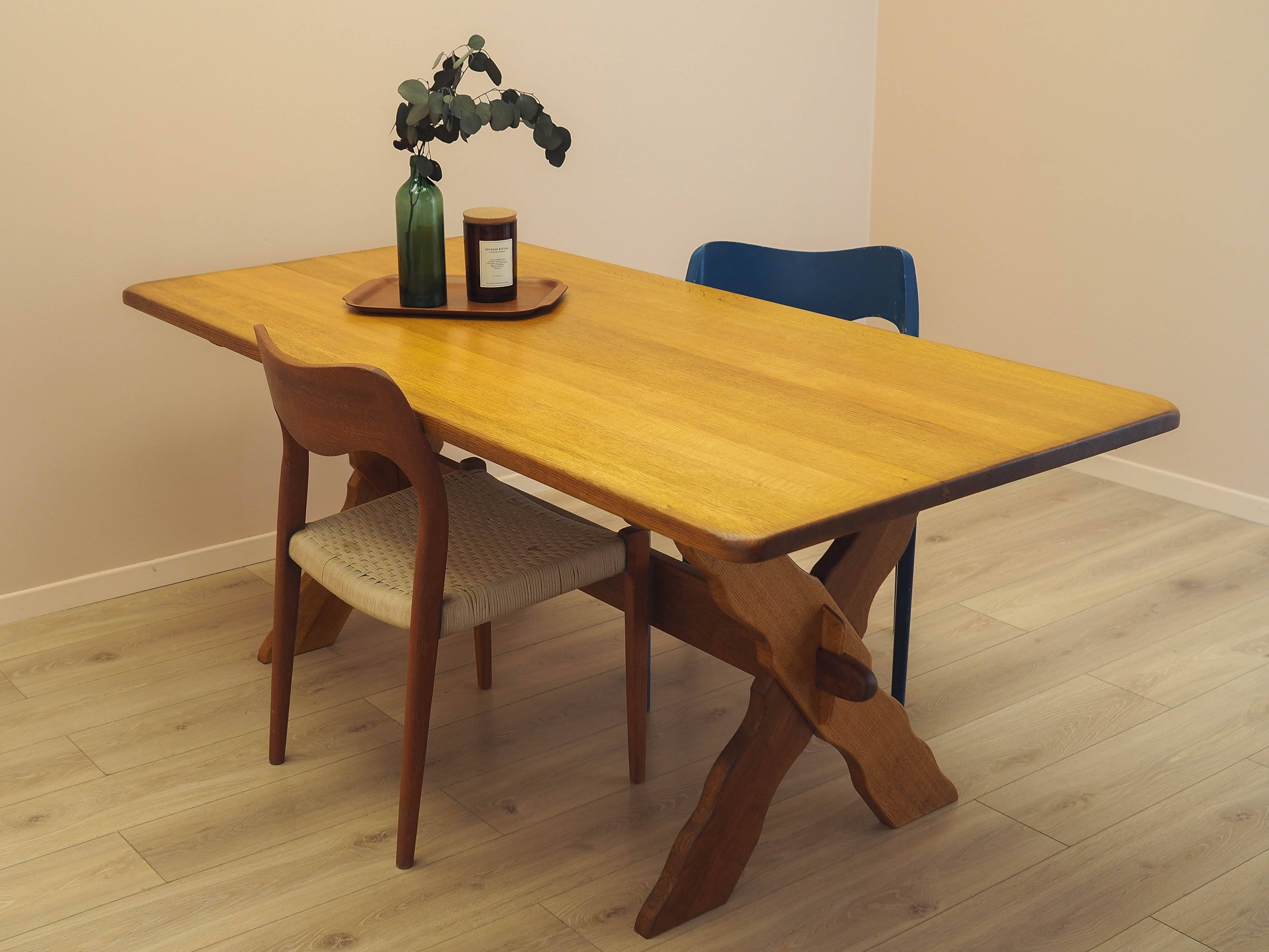 Solid oak dining table by Henning Kjærnulf, Denmark, 1960s