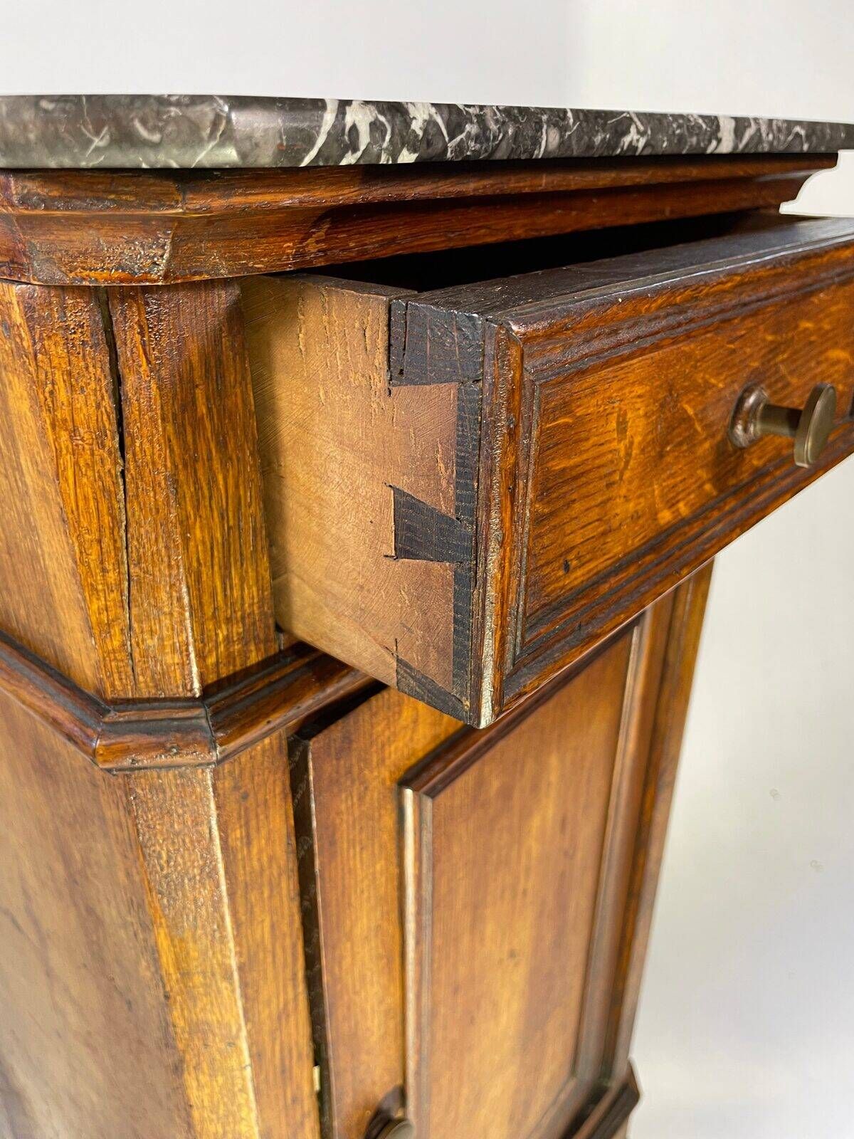 Provincial antique bedside table in oak, marble top, late 19th century.