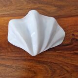 Shell holy water font emptier