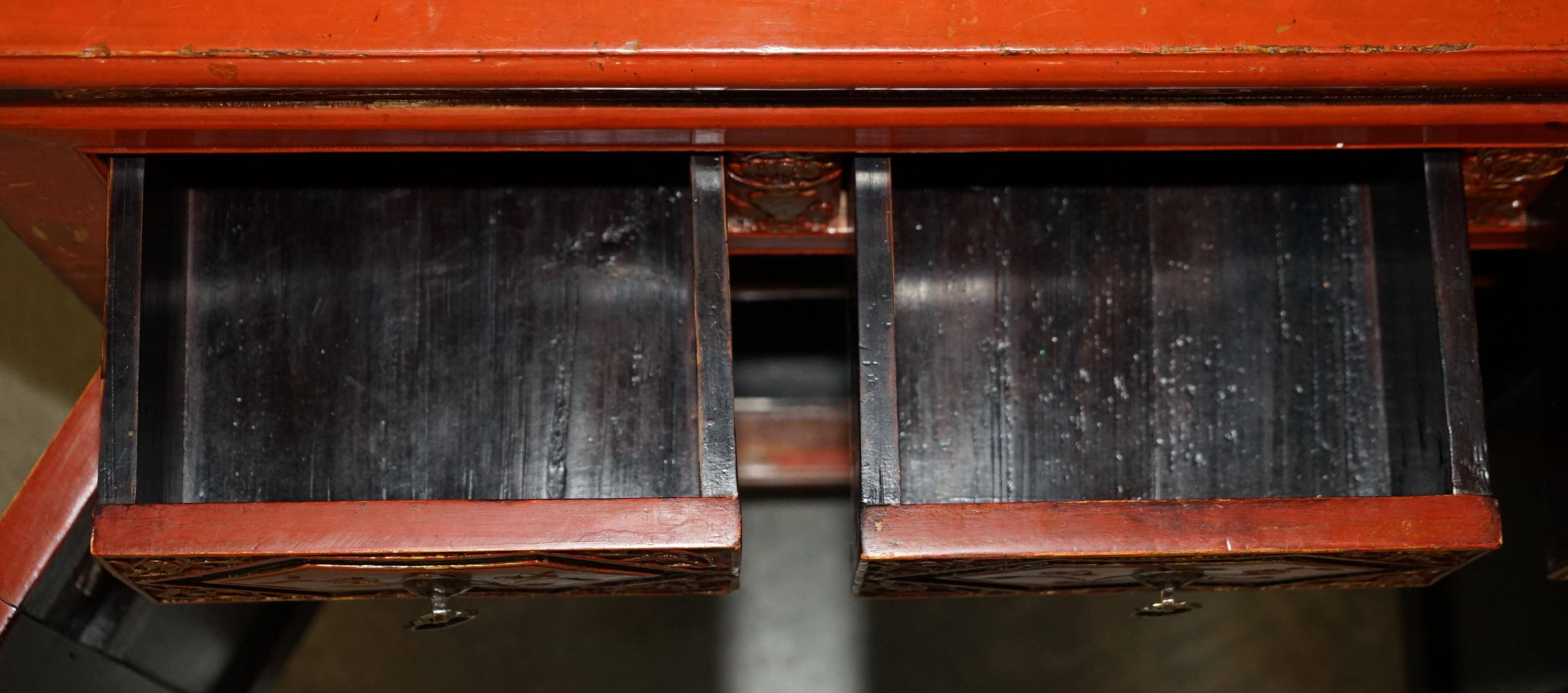 Vintage Chinese lacquered buffet decorated with gold leaf.