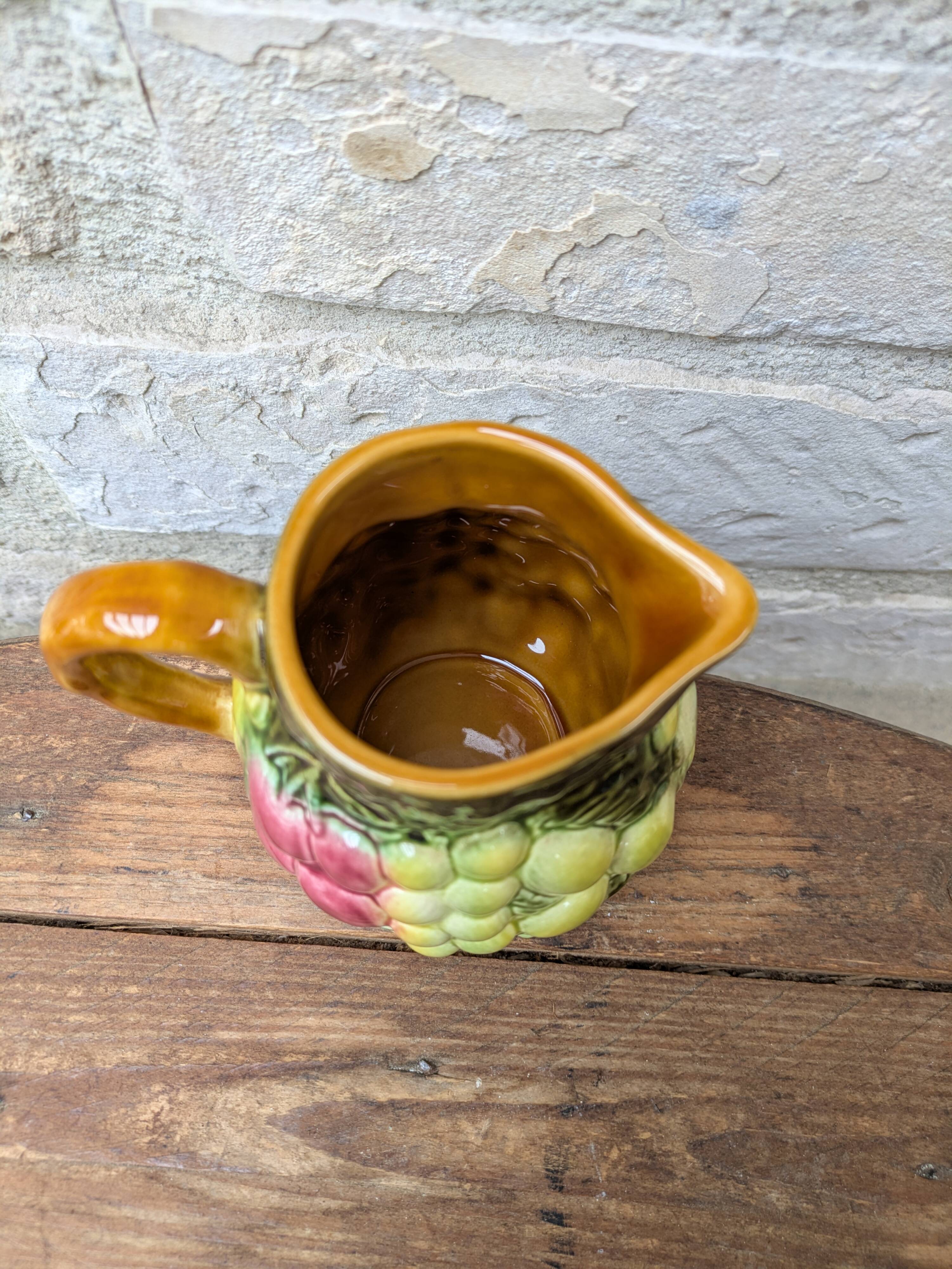Small jug, milk pot in slipware with relief fruits Salins les Bains