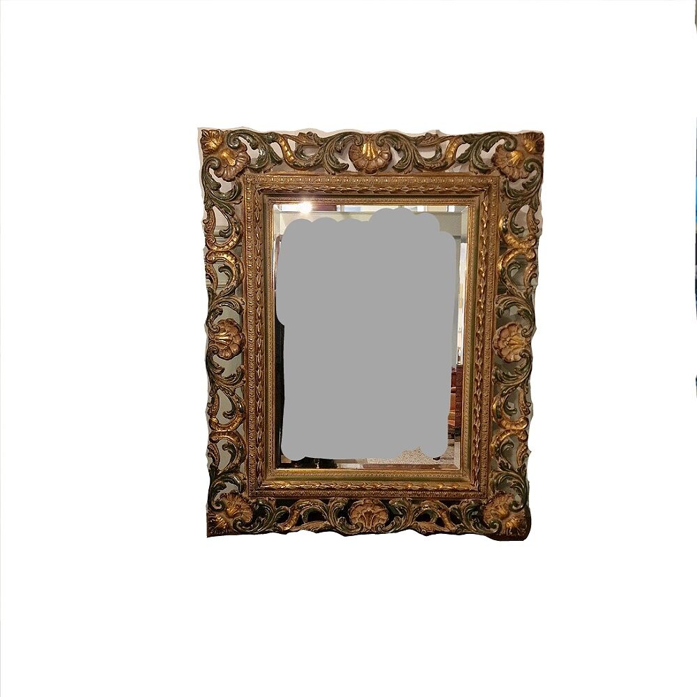 Bevelled mirror and carved wood