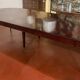 Directoire period extendable dining table in mahogany with a band.