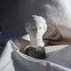 Plaster bust on a pedestal